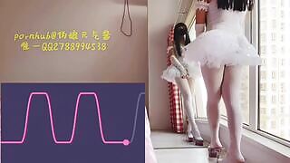 A Japanese ballerina puts on a show while moaning with the sex toy inside her anus 
